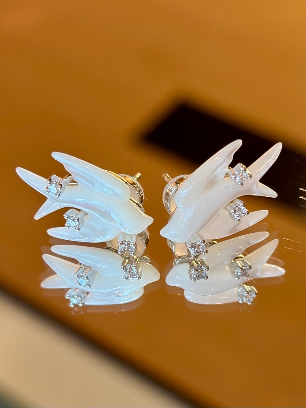 New S925 Sterling Silver Mother of Pearl Swallow Bird Earrings with Sparkling CZ